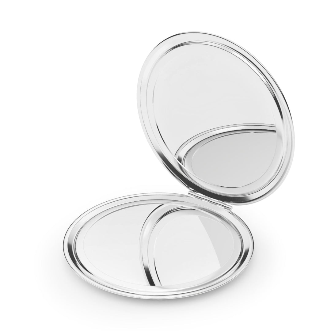 Sea Dragon Dreams round compact travel mirror with a polished silver metal finish and dual interior glass mirrors.