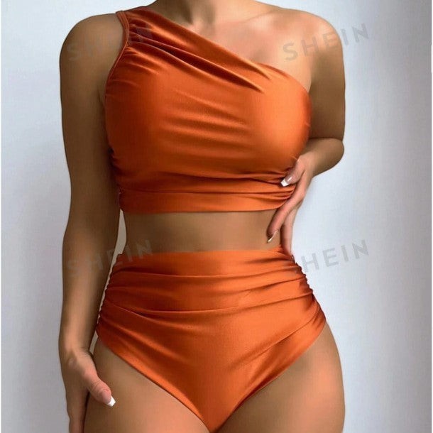 Sea Dragon Dreams rust orange one-shoulder bikini set with high-waisted bottoms in soft stretch fabric