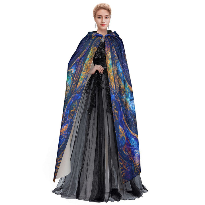 Model wearing a Sea Dragon Dreams Sacred Light hooded cloak with blue and gold spiritual artwork over a black dress.