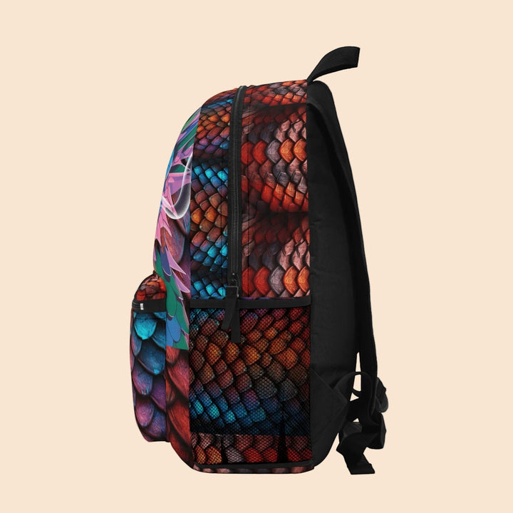 Sea Dragon Dreams backpack with a vibrant dragon eye graphic and textured red and blue dragon scales on polyester.