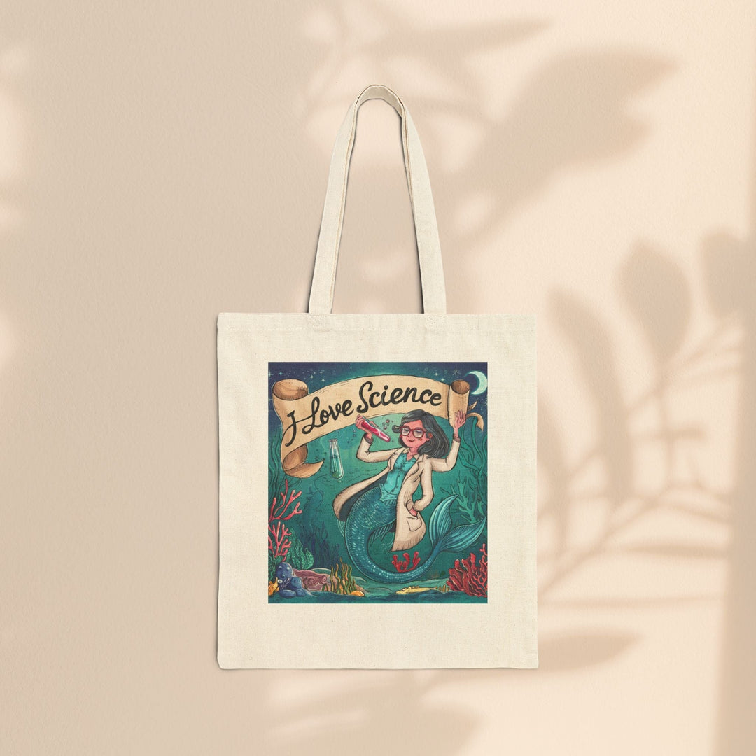 Sea Dragon Dreams cotton canvas tote bag featuring an I Love Science mermaid scientist illustration on a beige background