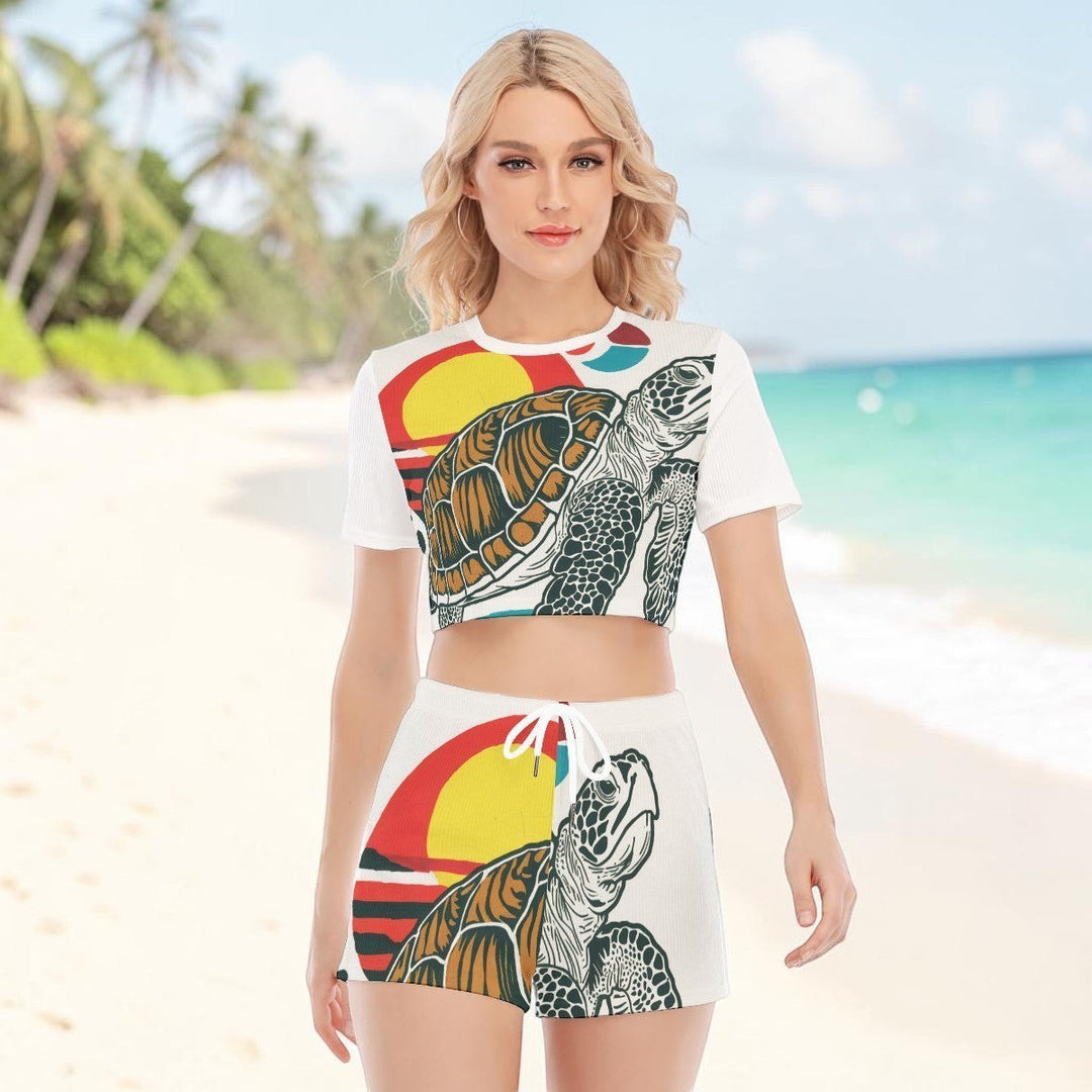 Sea Dragon Dreams women's white two-piece set featuring a sea turtle graphic, crew neck crop top, and drawstring shorts.