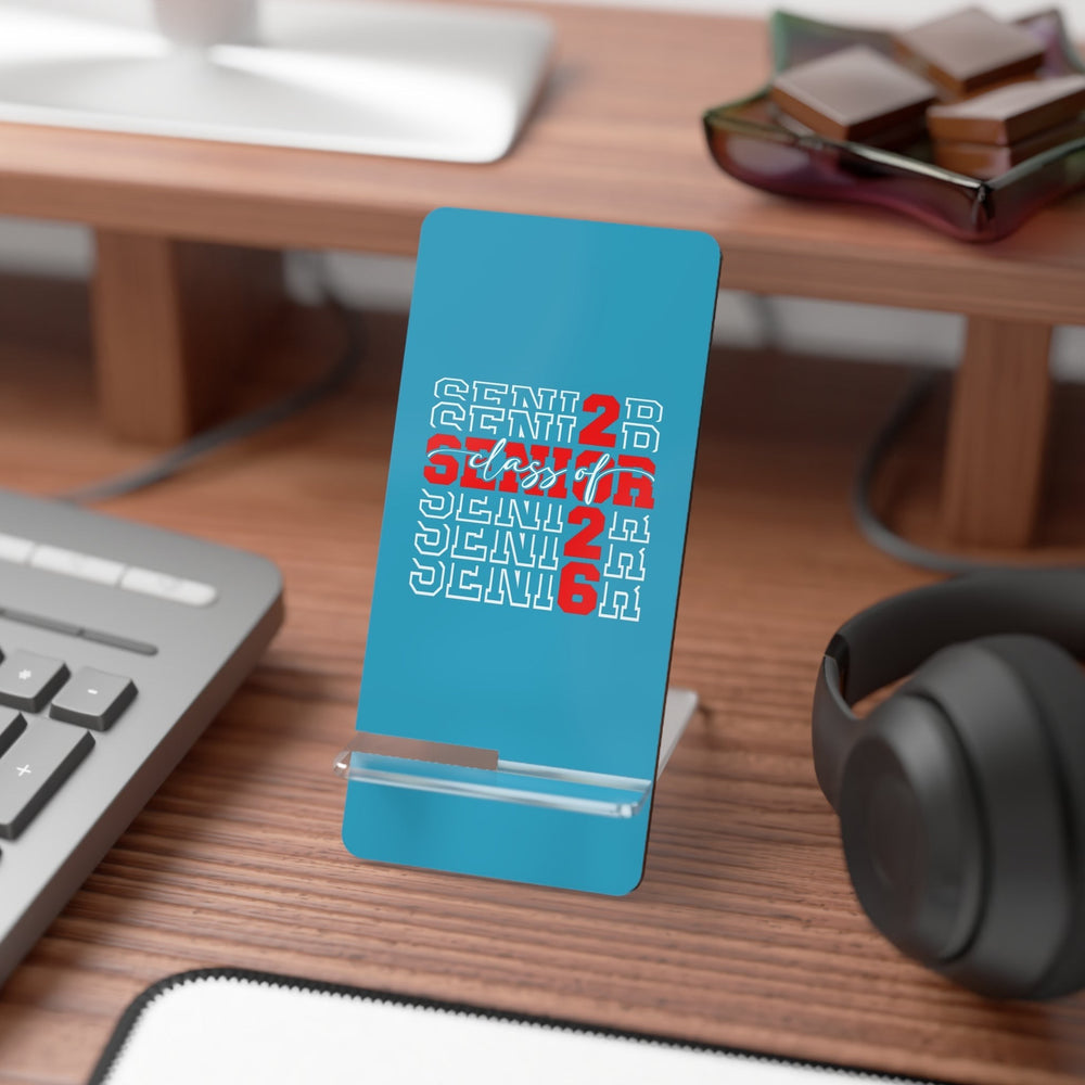 Sea Dragon Dreams Senior 2026 mobile display stand in blue with red and white typography on a wooden desk.