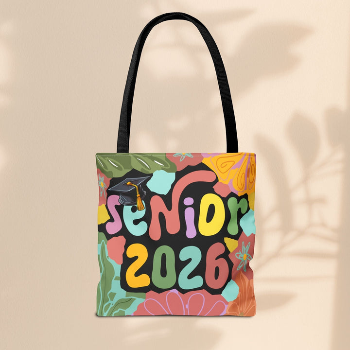 Sea Dragon Dreams Senior 2026 tote bag with colorful floral pattern and graduation cap graphic on durable polyester.