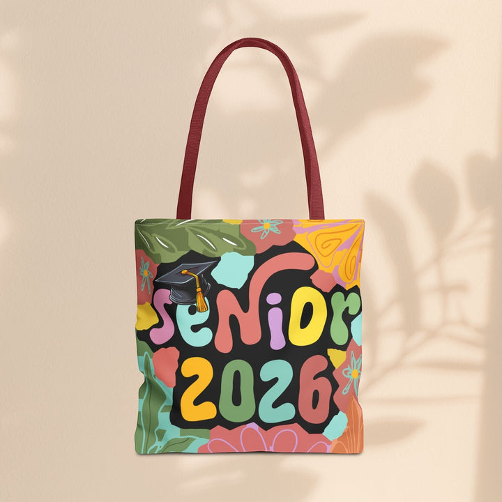 Sea Dragon Dreams Senior 2026 tote bag with colorful floral pattern and graduation cap design on polyester canvas.