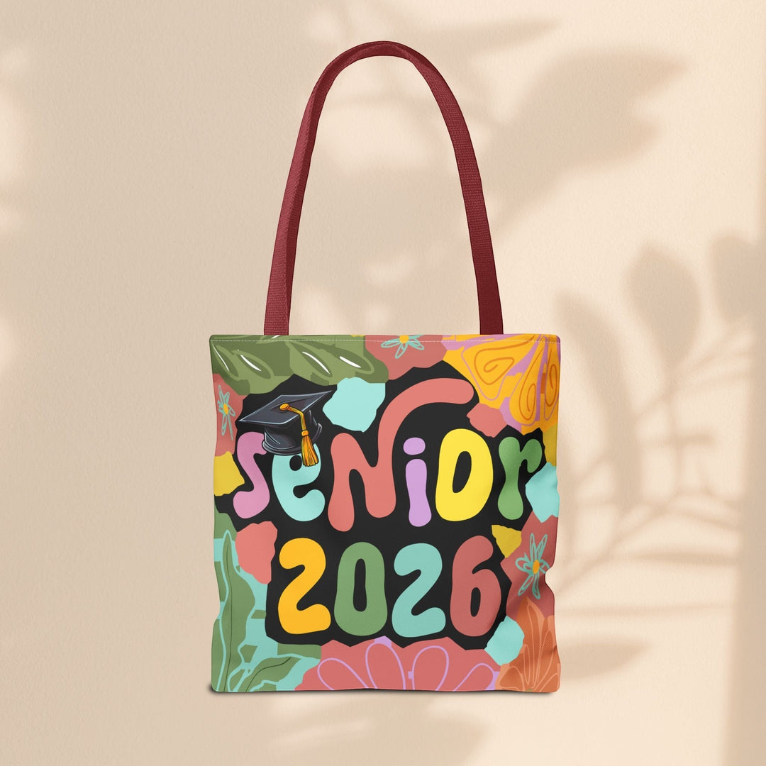 Sea Dragon Dreams Senior 2026 tote bag with colorful abstract floral print and graduation cap graphic on polyester.