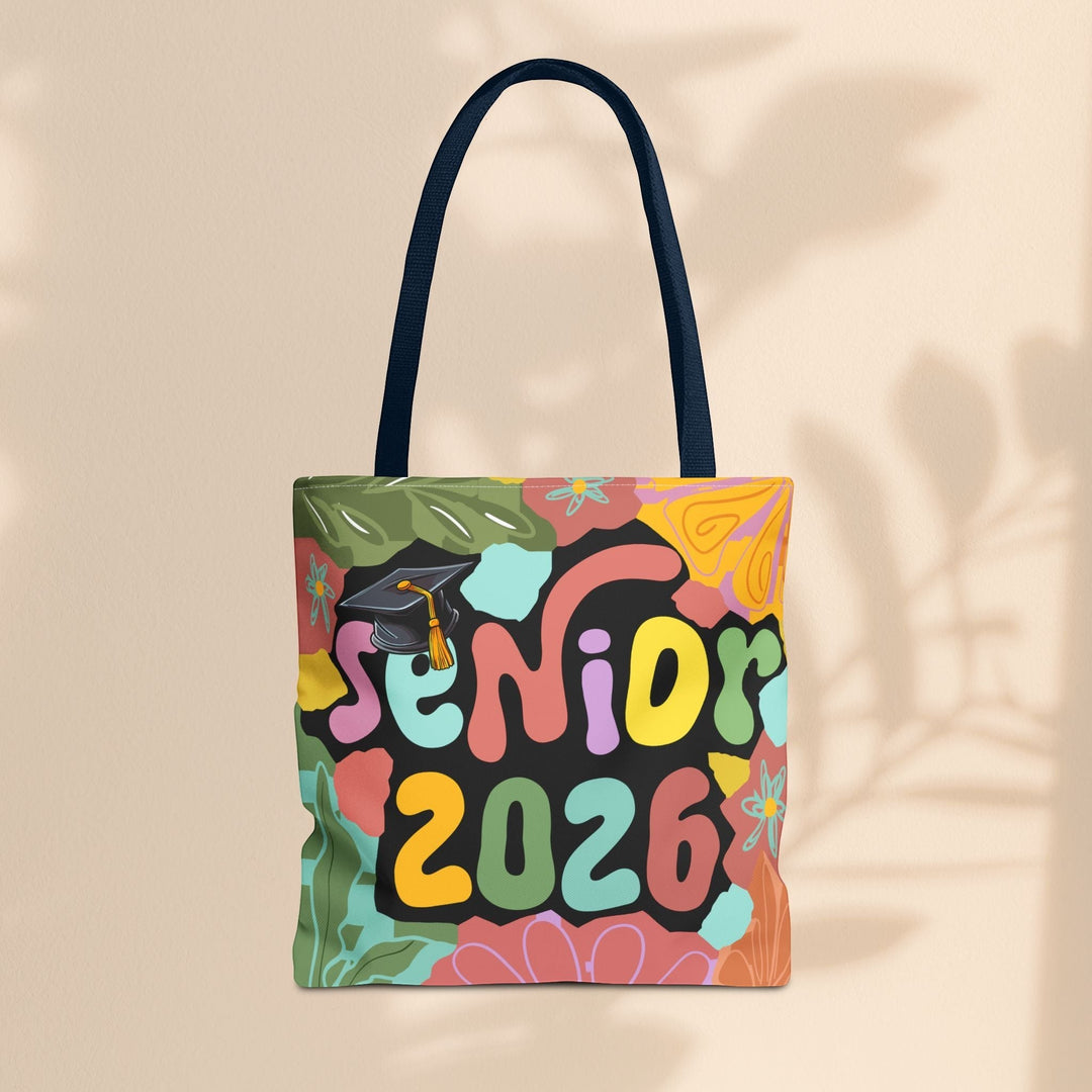 Sea Dragon Dreams Senior 2026 tote bag with colorful floral patterns, graduation cap graphic, and black handles.