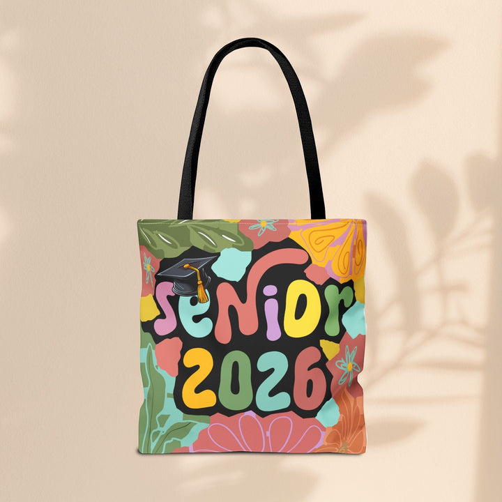 Sea Dragon Dreams Senior 2026 tote bag with colorful floral patterns and a graduation cap design on polyester fabric.