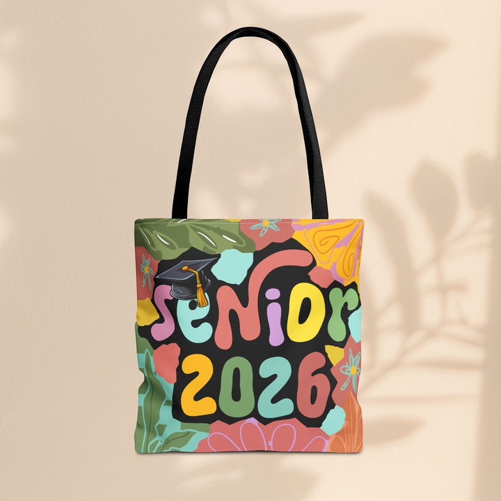 Sea Dragon Dreams Senior 2026 tote bag with colorful floral graphics and a graduation cap on a beige background.