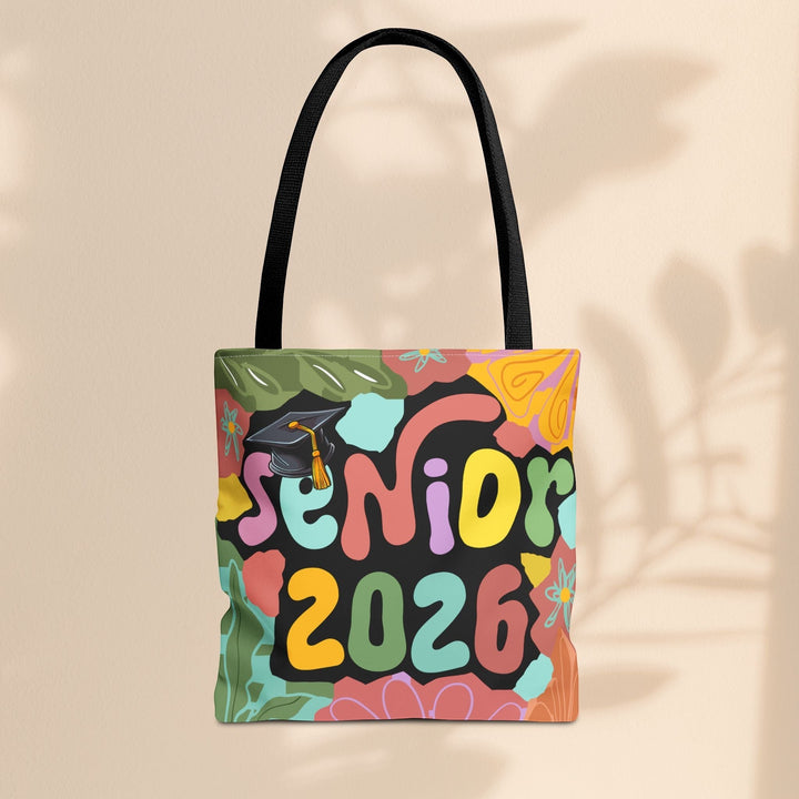 Sea Dragon Dreams Senior 2026 tote bag with colorful retro-style lettering and a graduation cap on a black background.