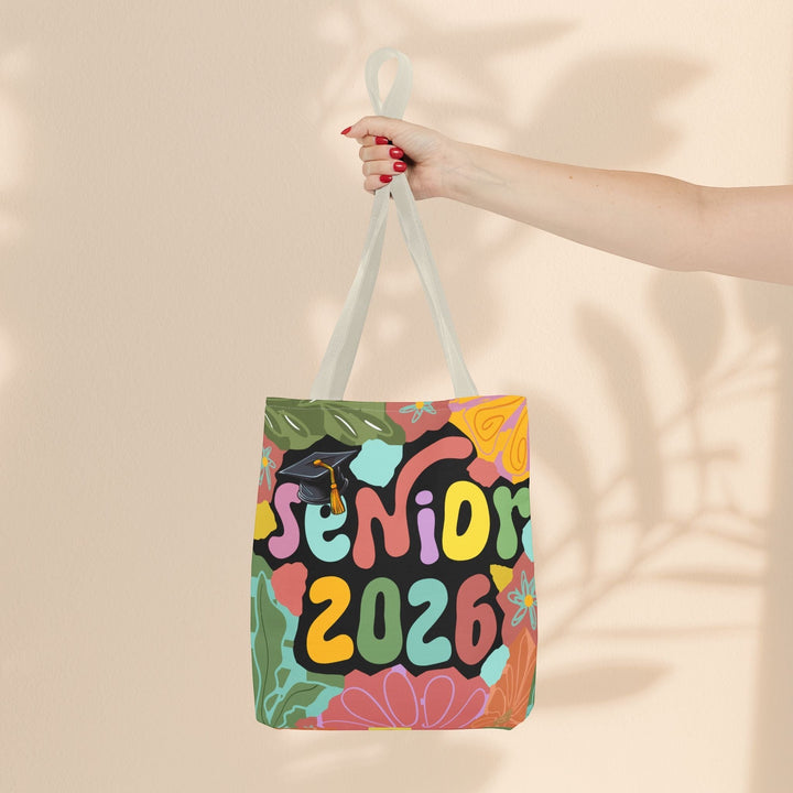 Sea Dragon Dreams Senior 2026 tote bag with colorful floral and graduation cap graphic on a durable polyester canvas.