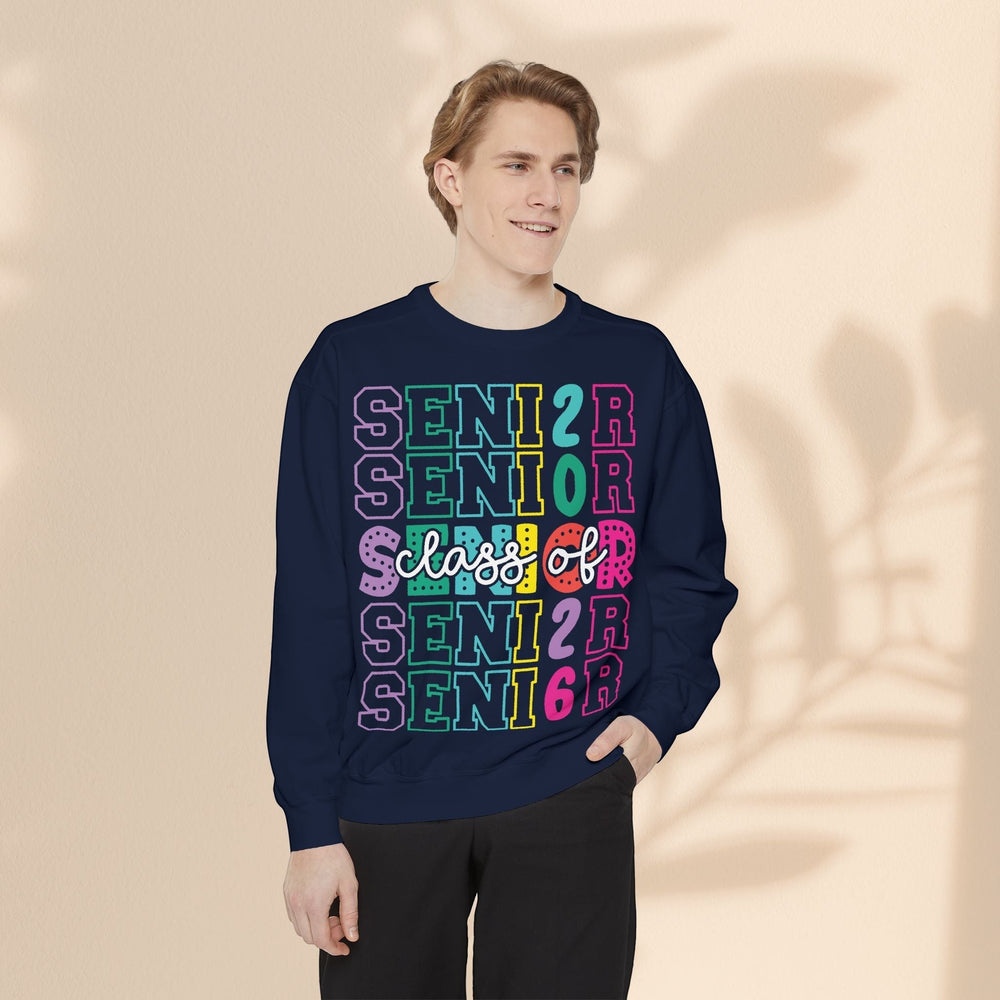 Sea Dragon Dreams navy blue unisex sweatshirt with colorful Senior Class of 2026 graphic print worn by a young man.