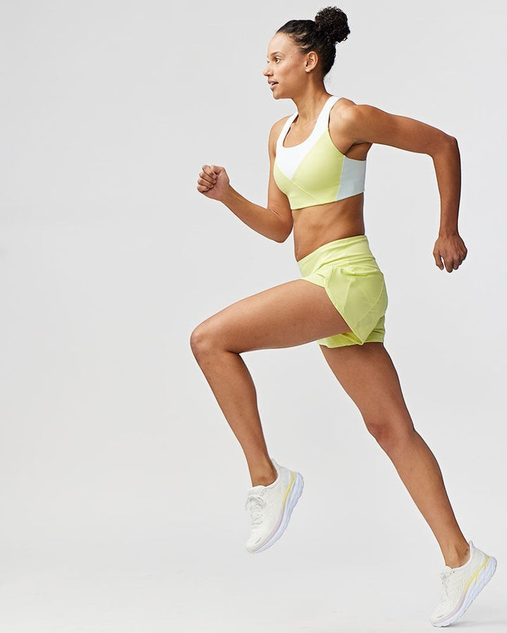 Sea Dragon Dreams Sheva high rise running shorts in pale yellow with a pleated design and built-in brief liner