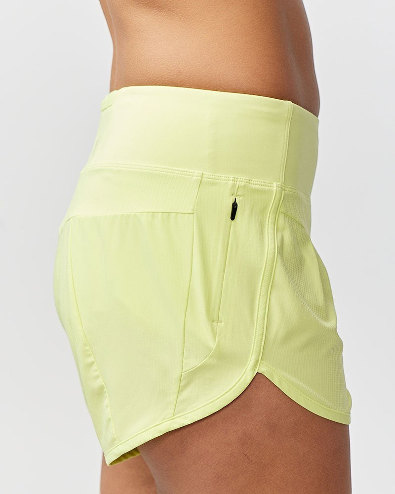 Sea Dragon Dreams Sheva high rise running shorts in pale yellow with a side zip pocket and flat knit waistband