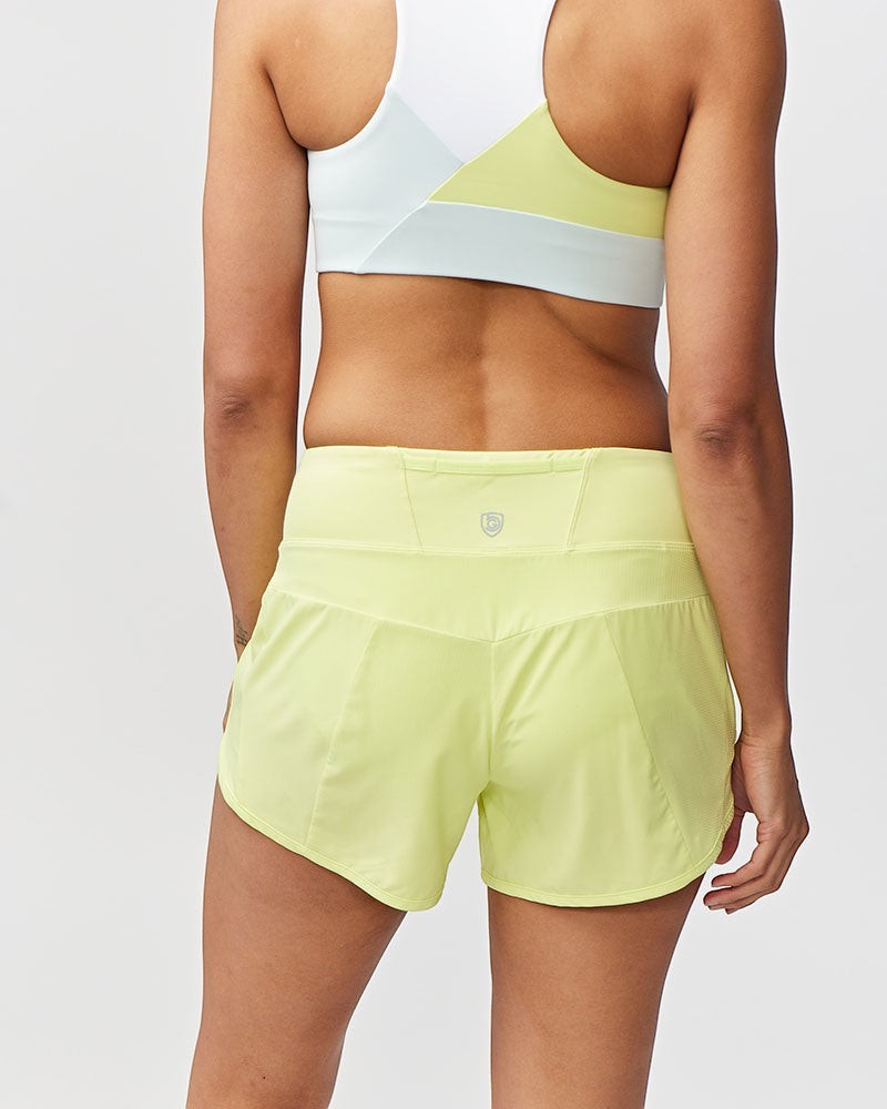 Sea Dragon Dreams Sheva high rise running shorts in pale yellow with a flat knit waistband and back zip pocket