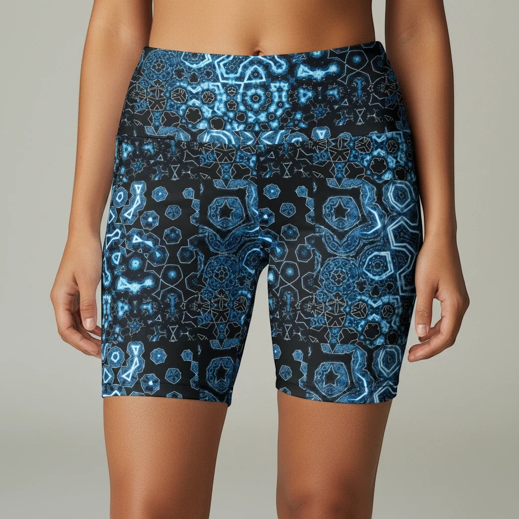 Sea Dragon Dreams women's workout shorts in Shifting Blues print, featuring a geometric blue pattern on polyester.