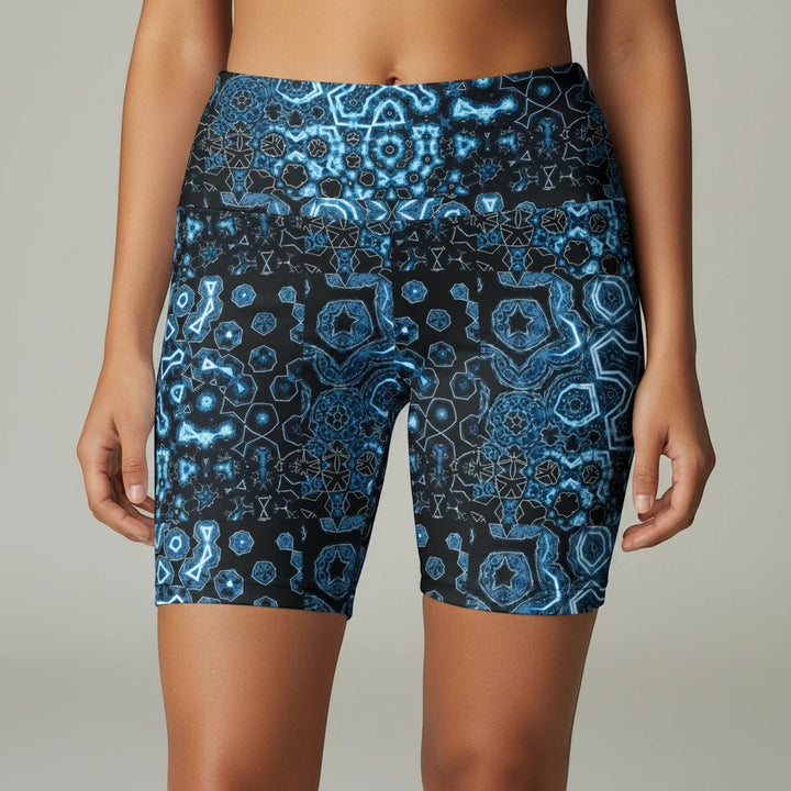 Sea Dragon Dreams women's workout shorts in Shifting Blues print, featuring a geometric blue pattern on polyester.