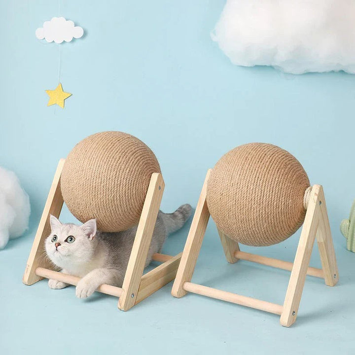 Sea Dragon Dreams cat scratching ball toy with natural sisal rope on a wooden stand, featuring a playful white cat.