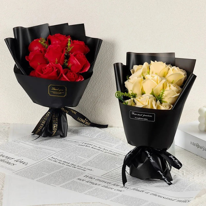 Sea Dragon Dreams artificial soap rose bouquets in red and champagne, wrapped in elegant black paper with ribbon.