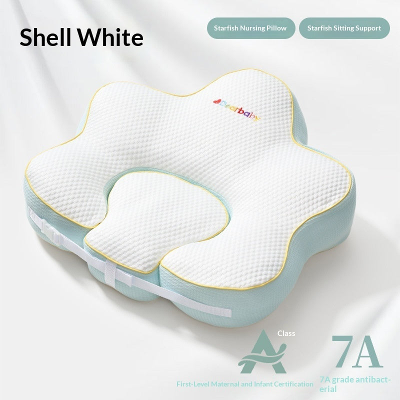 Sea Dragon Dreams shell white starfish-shaped nursing pillow with textured fabric and soft blue trim for infant support