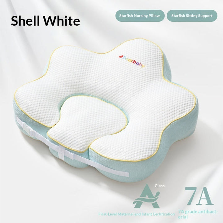 Sea Dragon Dreams shell white starfish-shaped nursing pillow with textured fabric and soft blue trim for infant support