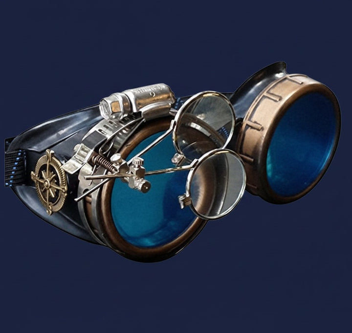 Sea Dragon Dreams handmade Victorian steampunk goggles with blue lenses, bronze-tone finish, and a removable loupe.