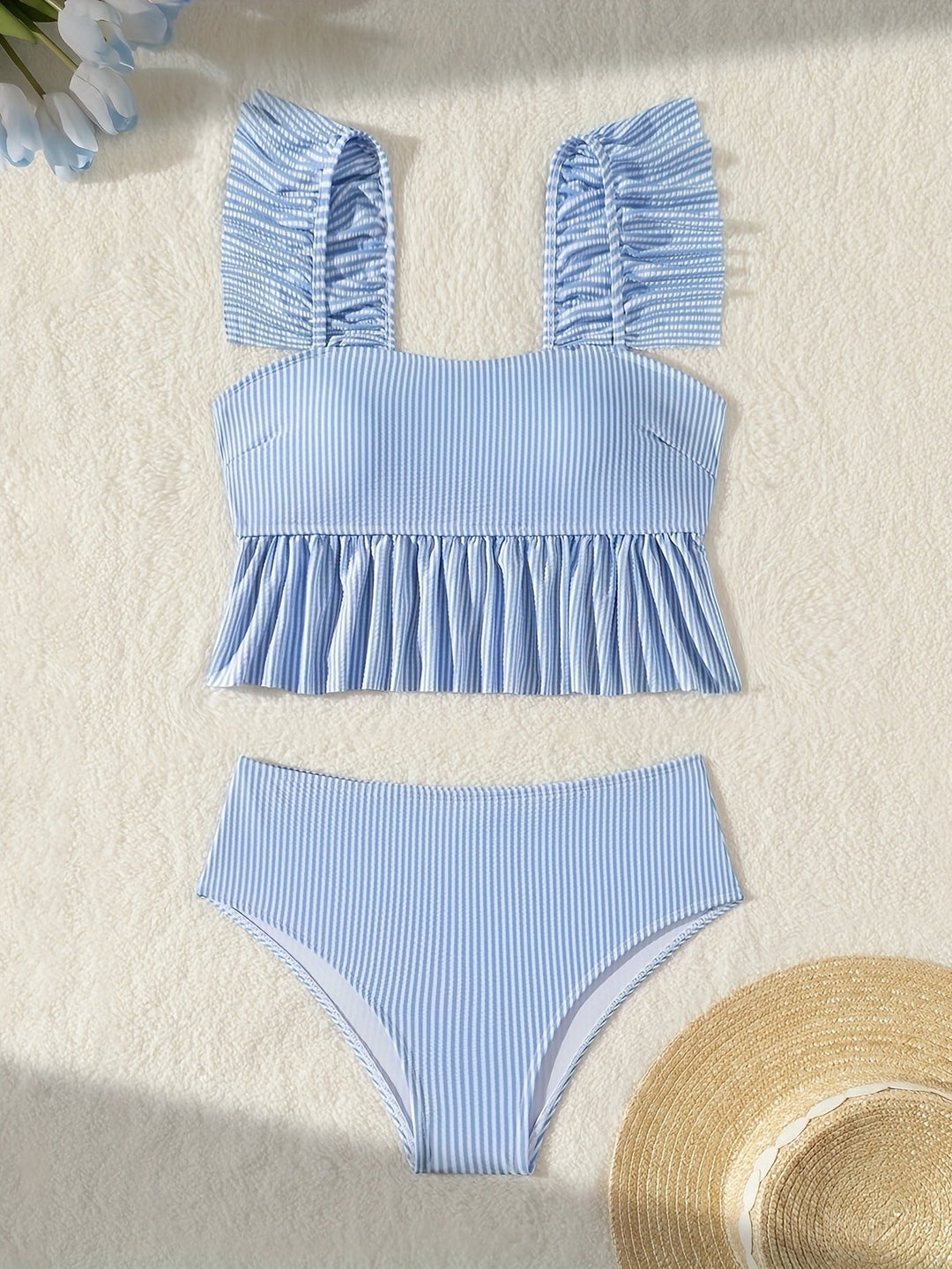 Sea Dragon Dreams blue and white striped two-piece bikini with ruffled shoulder straps and a peplum hem top.