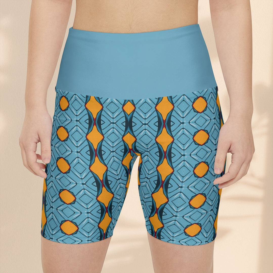 Sea Dragon Dreams women's workout shorts featuring a blue and orange geometric pattern with a high-waisted design.