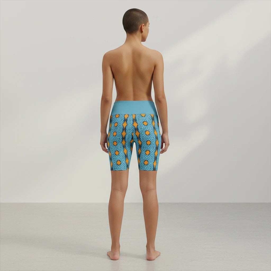 Sea Dragon Dreams women's workout shorts with blue and orange geometric striped pattern and high waistband