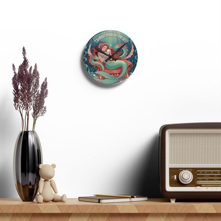 Sea Dragon Dreams Taurus Mermaid acrylic wall clock featuring a mother mermaid and child illustration on a white wall.
