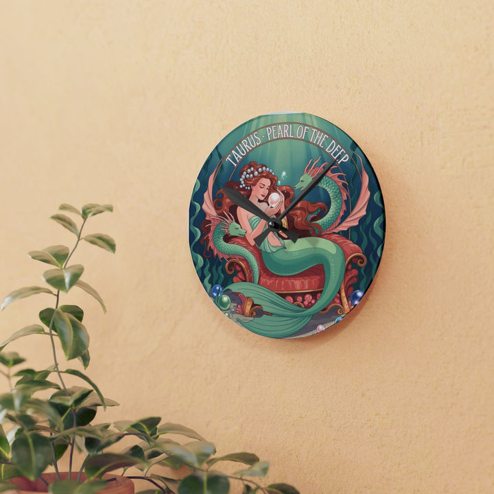 Sea Dragon Dreams round acrylic wall clock featuring a Taurus mermaid illustration with pearls on a beige wall.
