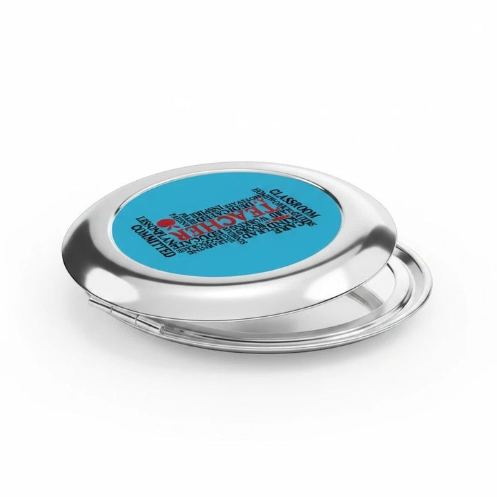 Sea Dragon Dreams round metal compact travel mirror with a blue Teacher Words design and dual interior glass mirrors.