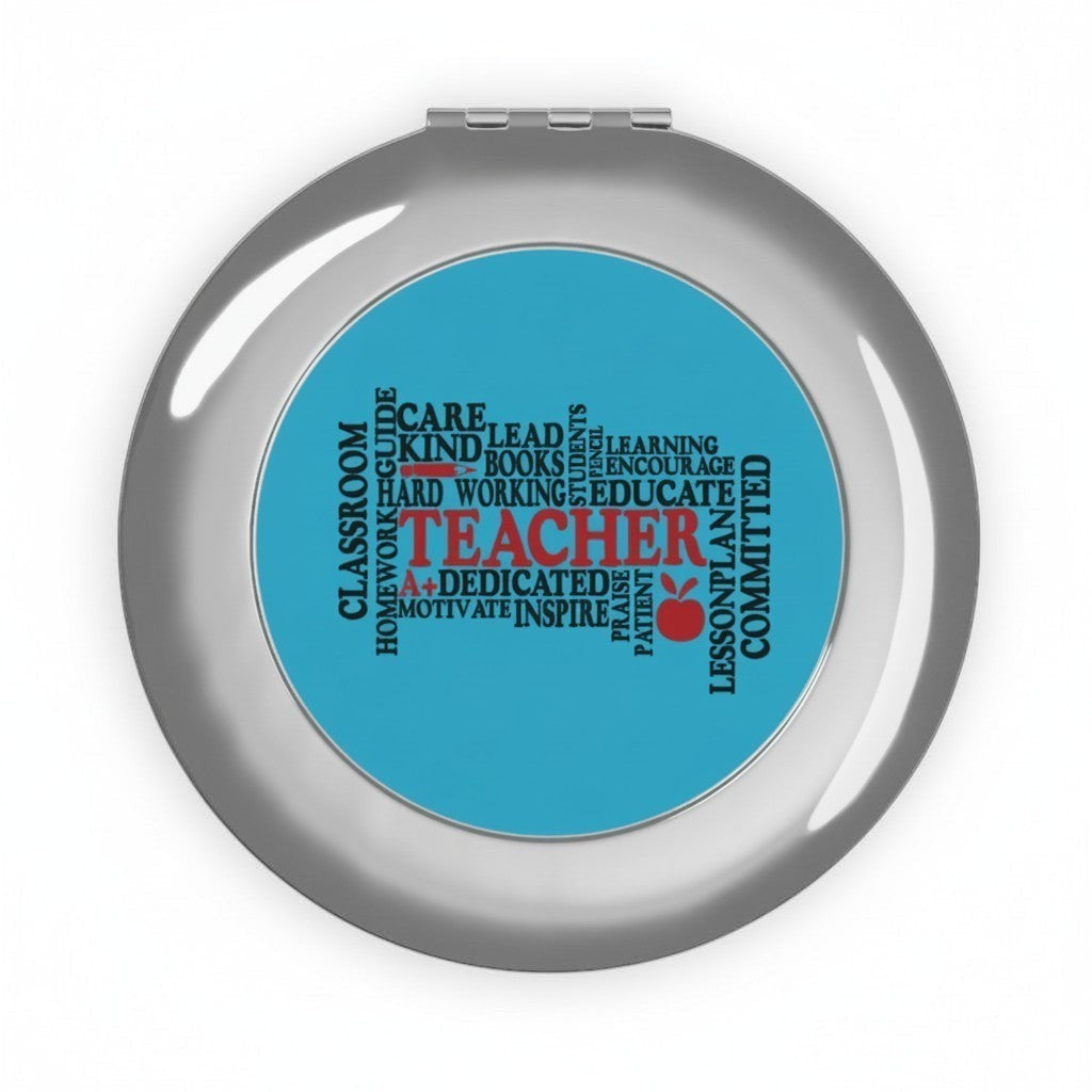 Sea Dragon Dreams round metal compact travel mirror featuring a blue Teacher Words typography design and apple icon.