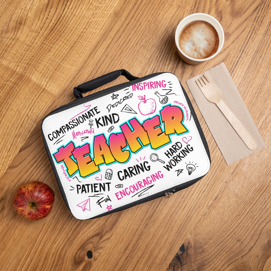 Sea Dragon Dreams Teacher Time lunch bag with colourful teacher-themed doodles on a wooden table with an apple.