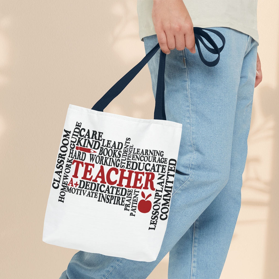 Sea Dragon Dreams What is a Teacher tote bag with black and red typography design held by a person in jeans.