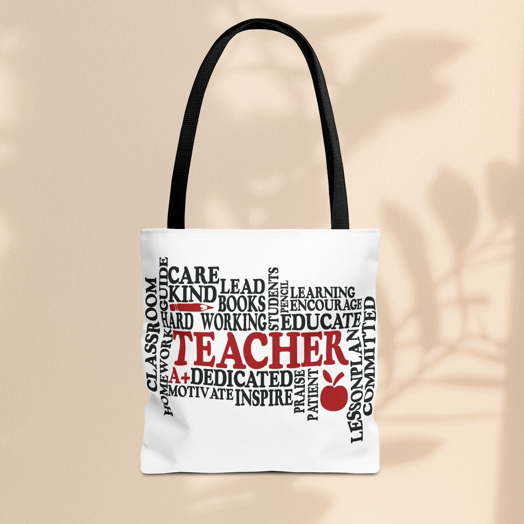 Sea Dragon Dreams What is a Teacher tote bag with black handles and red and black typography on white polyester.