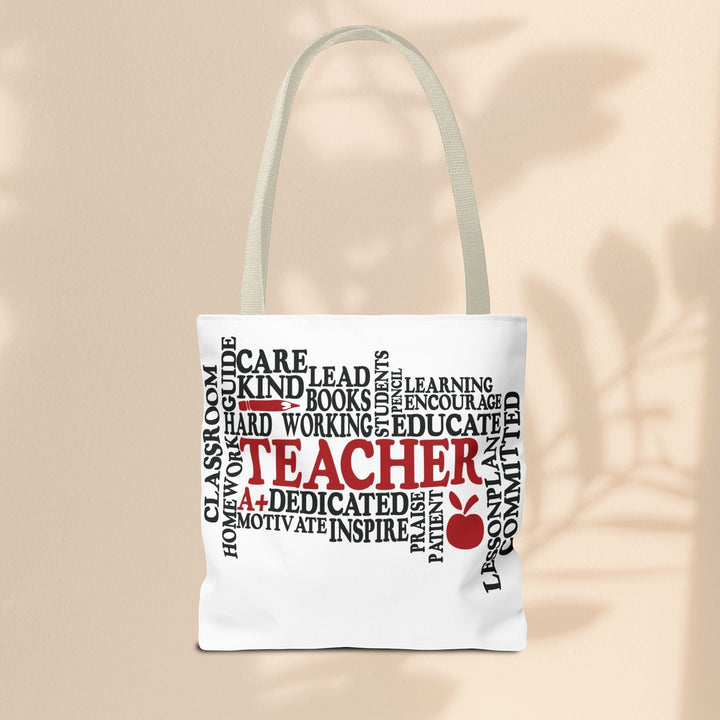 Sea Dragon Dreams What is a Teacher tote bag with black and red typography and apple icon on white polyester fabric