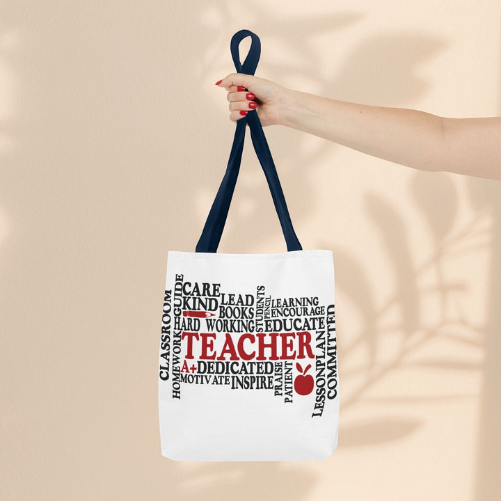Sea Dragon Dreams What is a Teacher tote bag with black handles and red and black typography on white polyester fabric