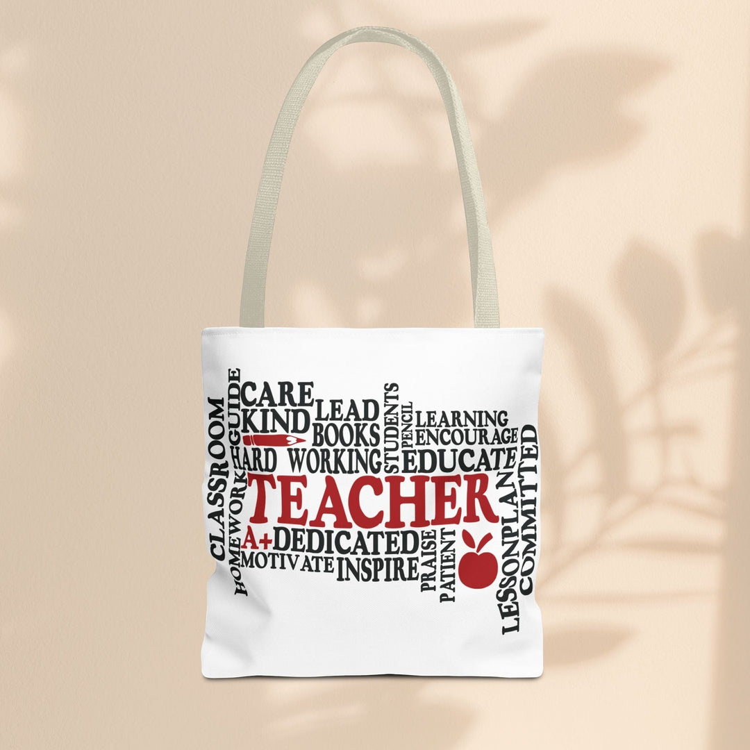 Sea Dragon Dreams white polyester tote bag featuring a black and red teacher-themed word cloud design with an apple.