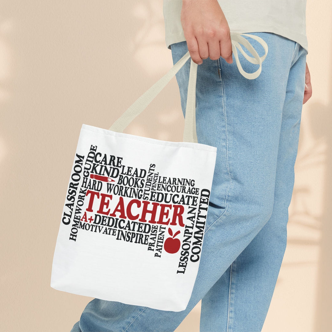 Sea Dragon Dreams white polyester tote bag with teacher-themed typography print held by a person in jeans