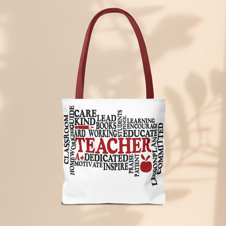 Sea Dragon Dreams What is a Teacher tote bag with red handles and black and red typography design on white polyester.