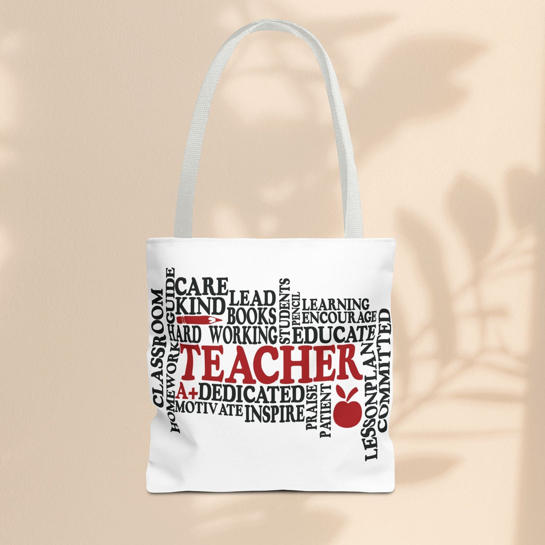 Sea Dragon Dreams white polyester tote bag featuring a black and red teacher-themed word cloud design with an apple.