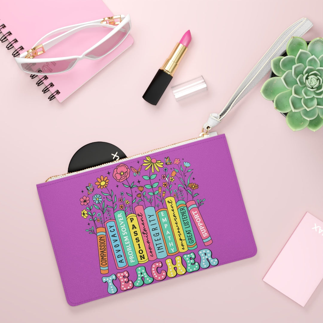 Sea Dragon Dreams Teachers are Special purple faux leather clutch bag with floral book design and wrist strap.