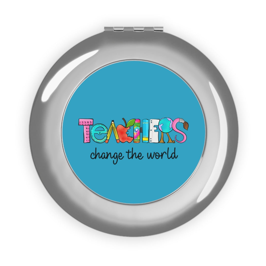 Sea Dragon Dreams compact travel mirror with a Teachers Change The World design on a polished silver metal case.