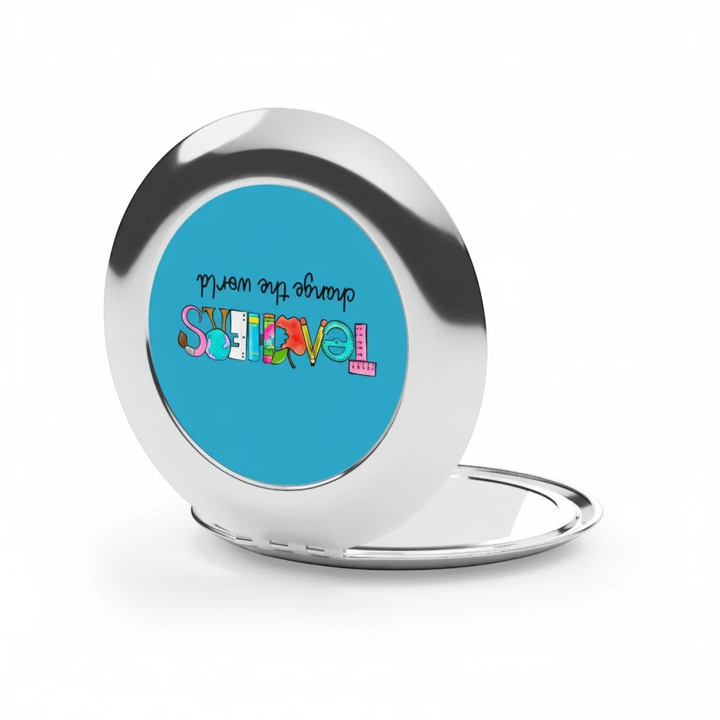 Sea Dragon Dreams Teachers Change The World compact travel mirror with a polished silver metal finish and blue insert.