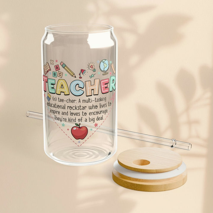 Sea Dragon Dreams 16oz clear glass sipper with Teachers Heart design, bamboo lid, and straw on a beige background.