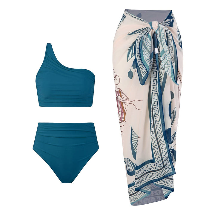 Sea Dragon Dreams teal one-shoulder bikini set with high-waisted bottoms and a matching patterned sarong wrap