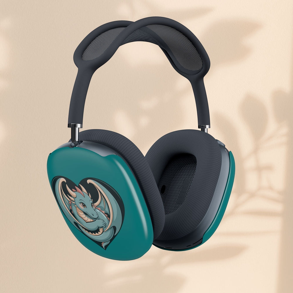 Sea Dragon Dreams teal polycarbonate shell covers on AirPods Max with a cute dragon heart illustration.
