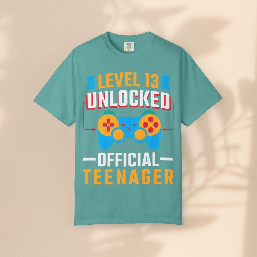 Sea Dragon Dreams teal cotton gamer t-shirt featuring a Level 13 Unlocked Official Teenager graphic with controller.