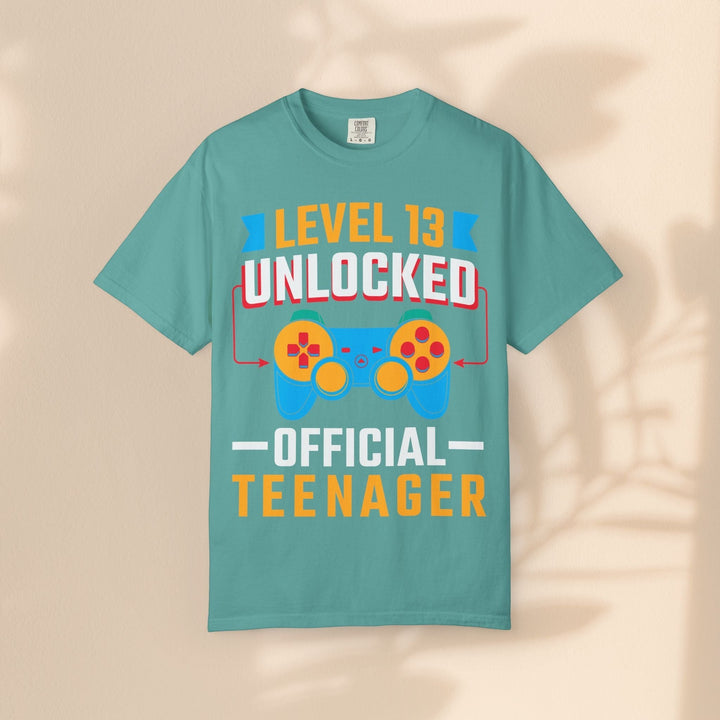 Sea Dragon Dreams teal cotton gamer t-shirt featuring a Level 13 Unlocked Official Teenager graphic with controller.